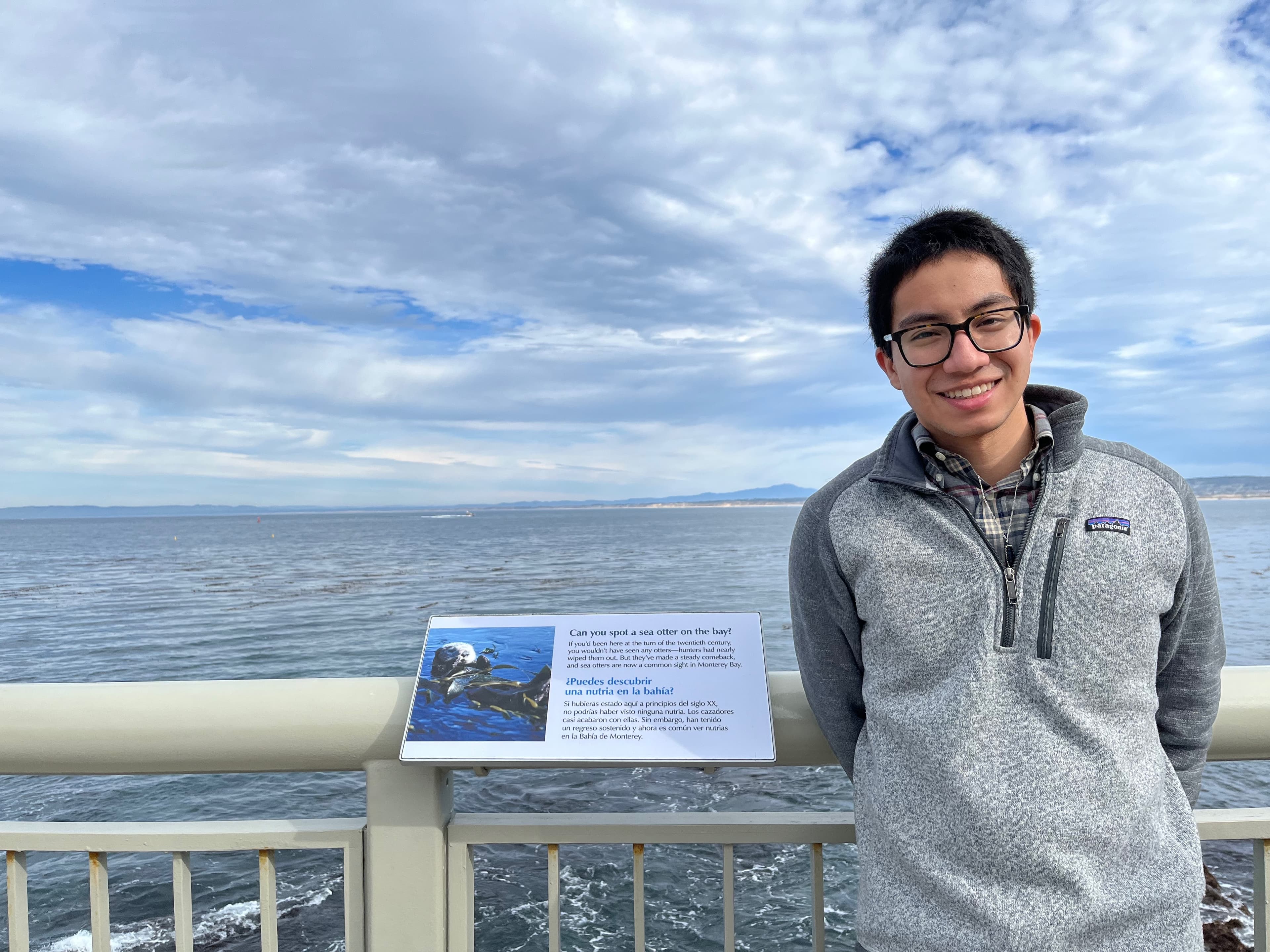 Picture of Edric in front of the ocean